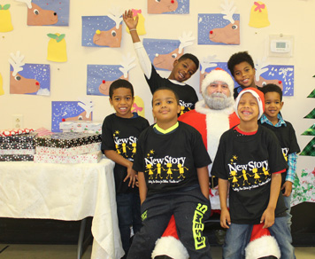 Students in an autism support program smile as they visit with Santa Claus