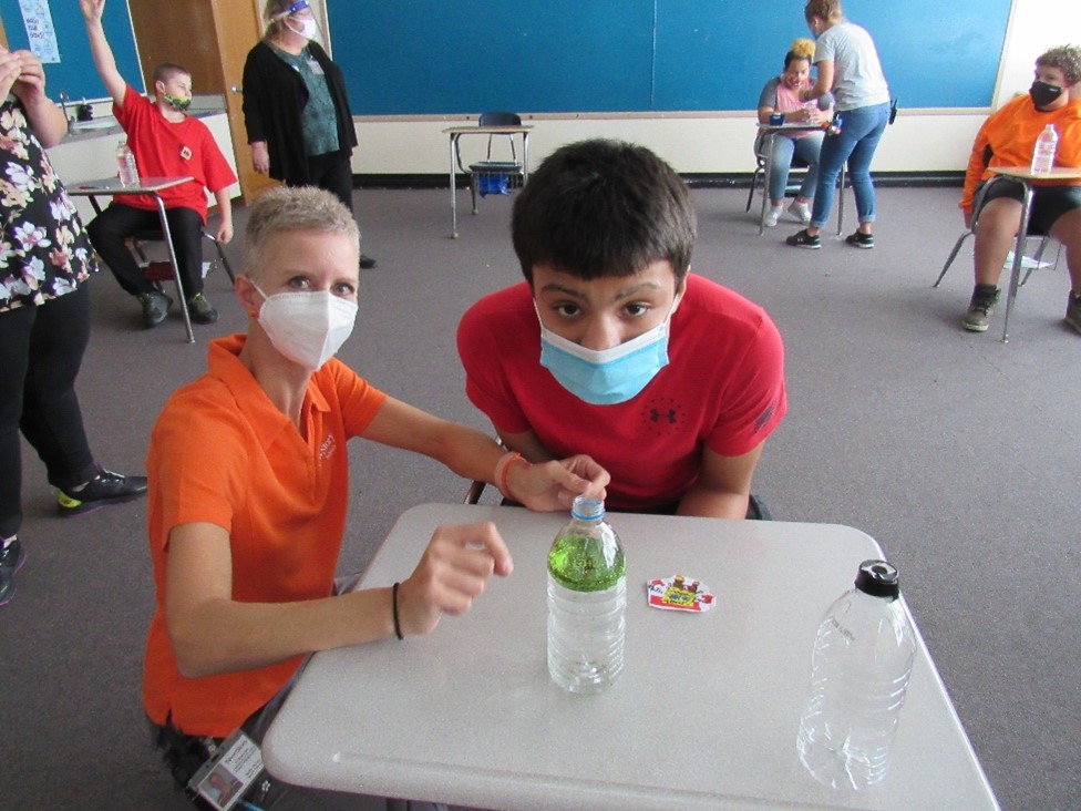 Students learn about tornadoes in class and make their own using soda bottles.