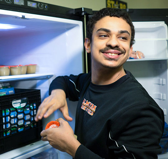 Student learning food preparation and life skills to prepare for a transition into adulthood