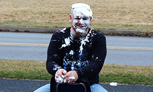 Students pie staff members for the fundraiser