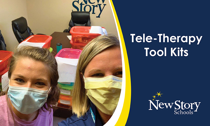 Two Occupational Therapists in Masks in front of a table of colored plastic box kits for students to work on at home. 