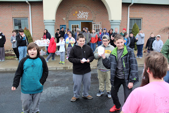 Children gather out outside of their special education school