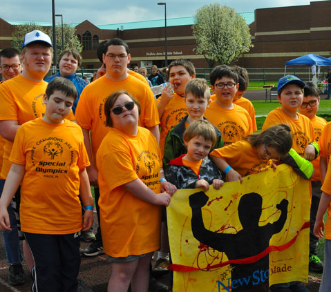 Children gather out outside of their special education school