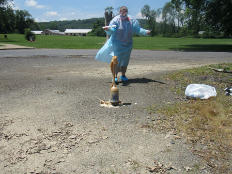 A high school student works on a STEAM project outside of her special education school, watching as her experiment erupts. 