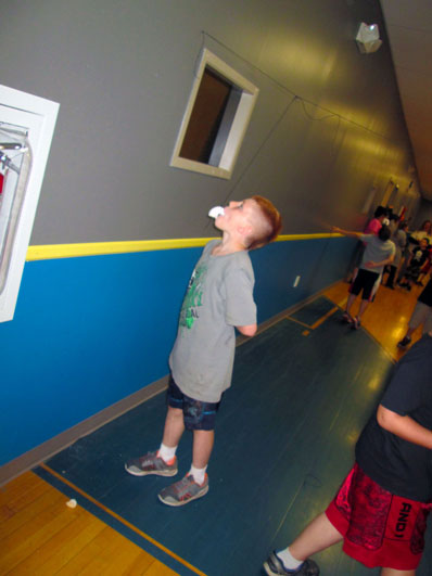A young boy participates in an event at his special education school.