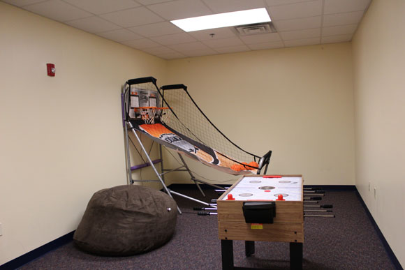 Interior photo of a game room used to incentivize students at a special education school 