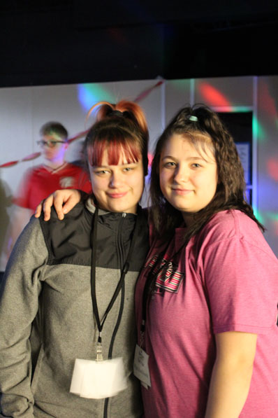 Two special education teachers smile at the camera.