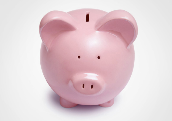 A pink piggy bank indicates saving money