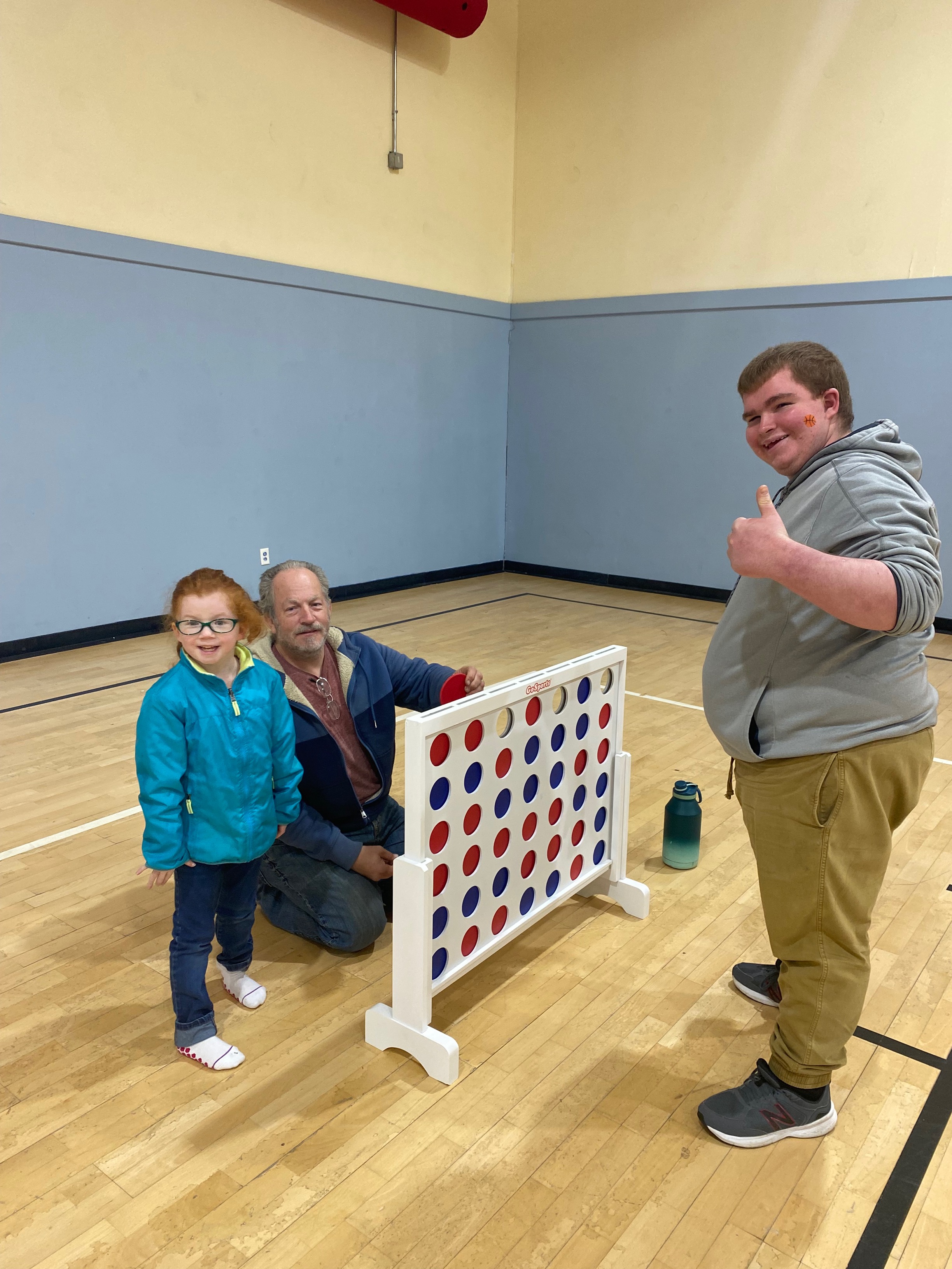 Family playing Connect4