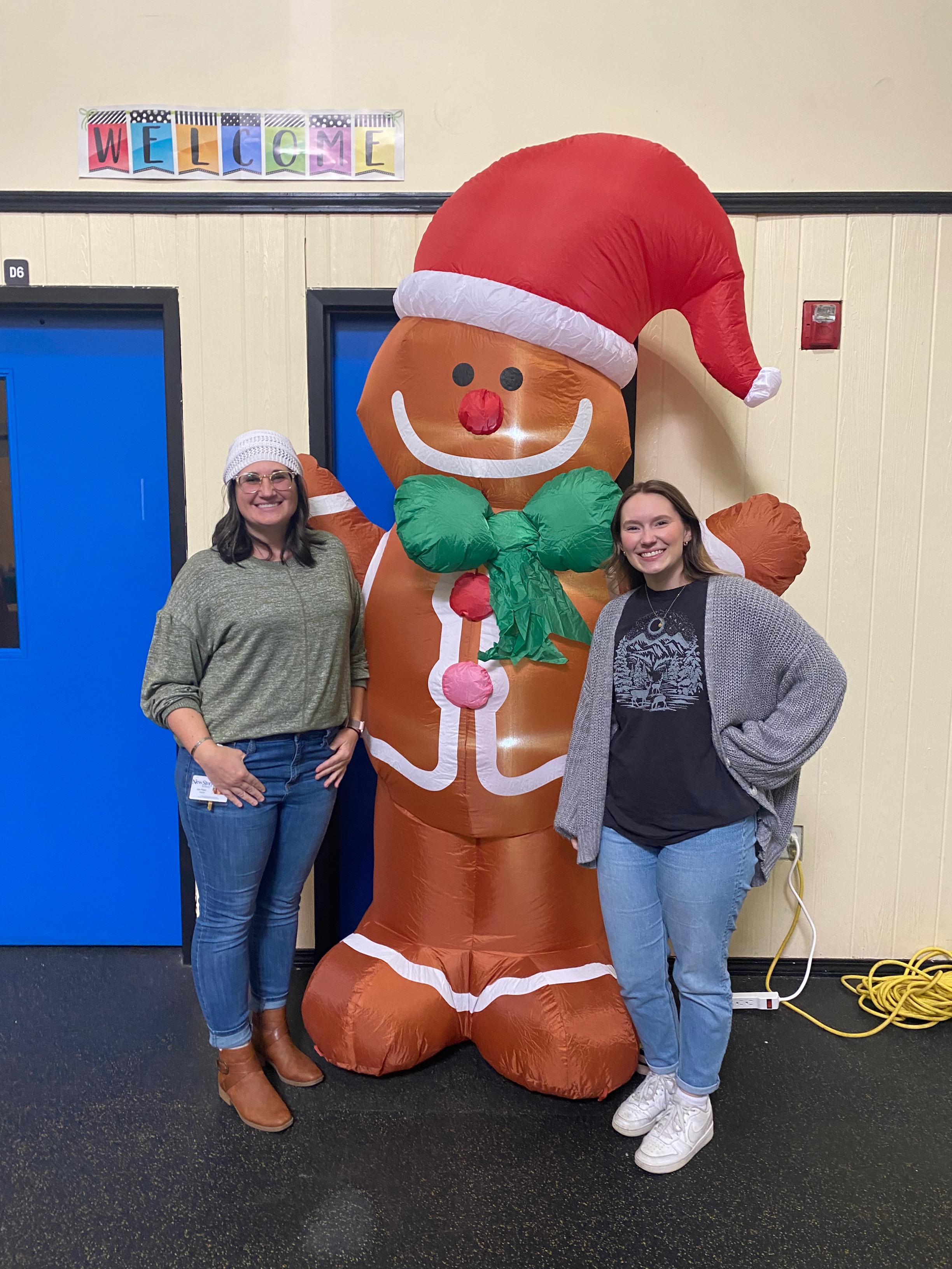 Staff members with gingerbread man