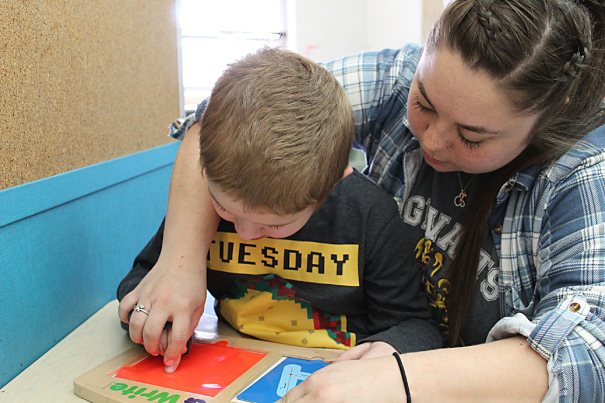 Young student working on letters