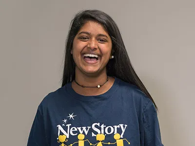 Female special education staff member at a school laughing.